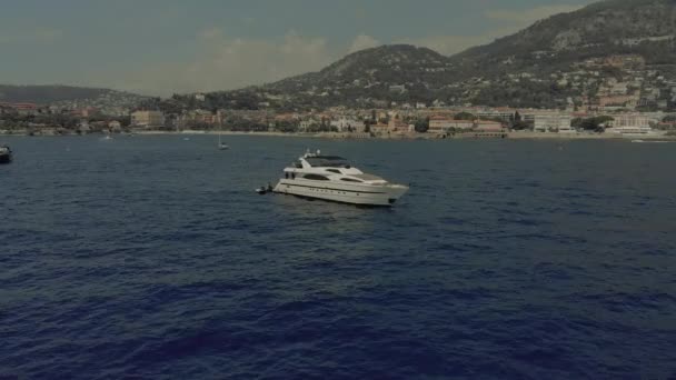 Beautiful yacht in the blue sea off the coast of France Monaco city town Monte Carlo Drone flight port yahts sea flats — Stock Video