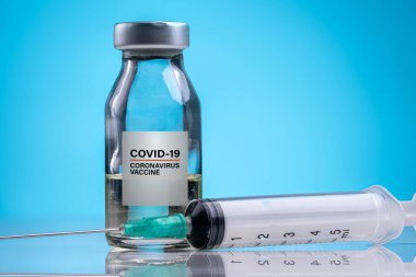 Mavi arka planda Coronavirus Aşısı / Corona Virüsü Aşısı kavramı