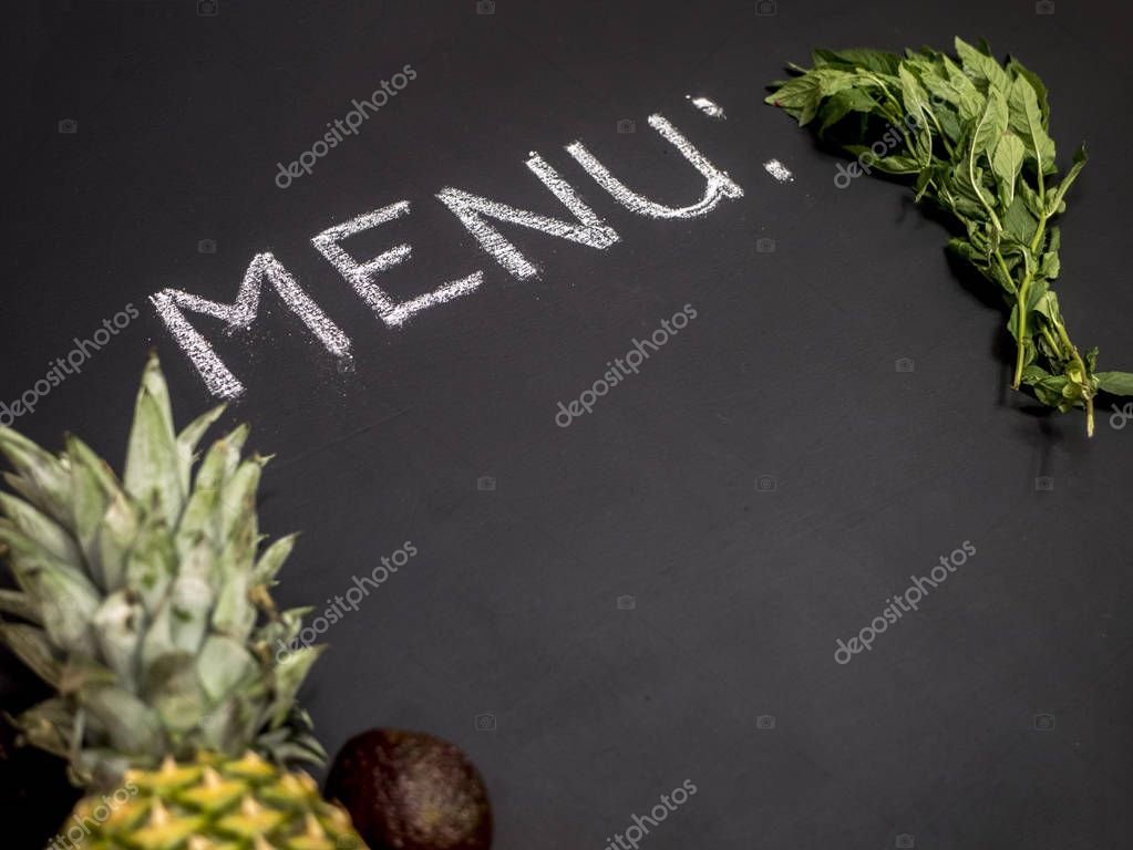 Menu text on a blackboard with mint pineapple and avocado with copy space mockup