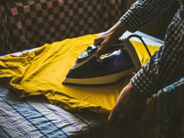 Close Person Hands Ironing Shirt Summer Morning Bedroom Yellow Sunshine — Stock Photo, Image