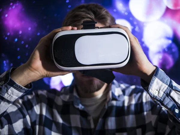 close up man head in virtual reality headset on abstract background, toned, concept