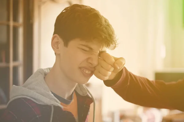 two young men fight each other and punch fist in face close up  f