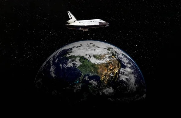 Space ship shuttle on the earth orbit in atmosphere. flying in outer space. Elements of this image furnished by NASA — Stock Photo, Image