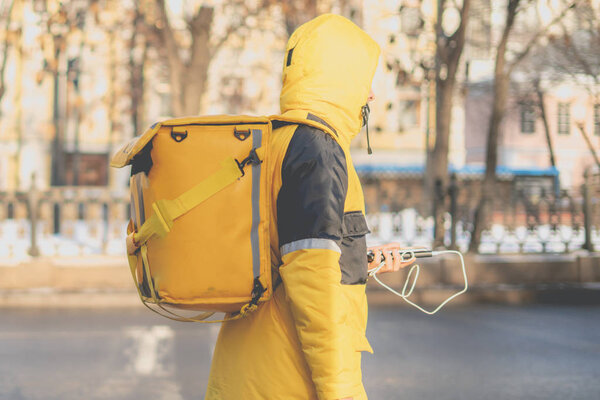 courier delievery guy with huge backpack on foot b