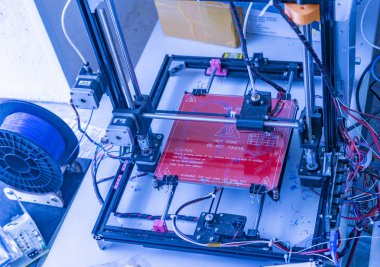 close up photo of futuristic 3d printer. micro and nano electronics b clipart