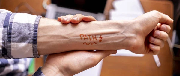 Pain or ache text word on persons hand concept, creative idea b — Stock Photo, Image