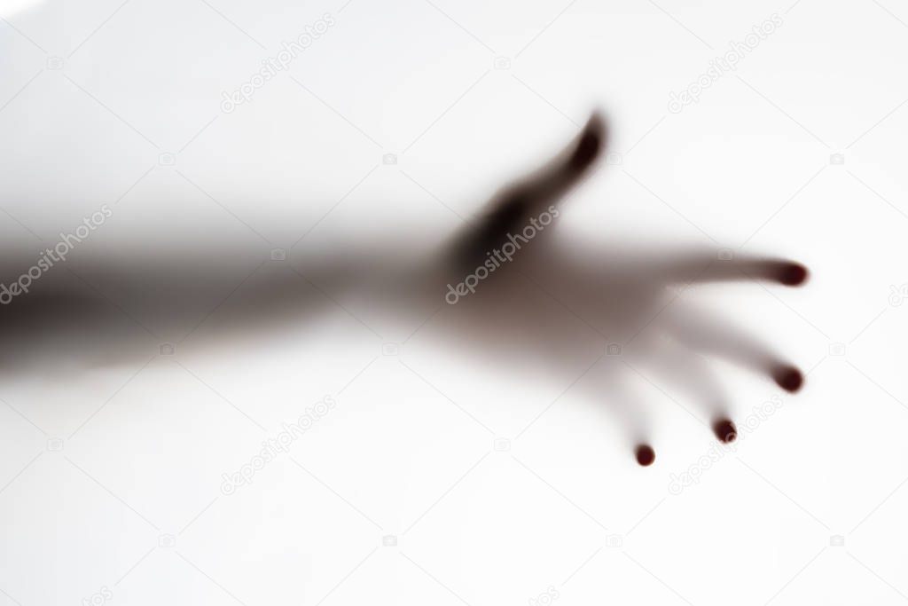 shillouette of a persons hand on a white background, abstract nightmare concepts