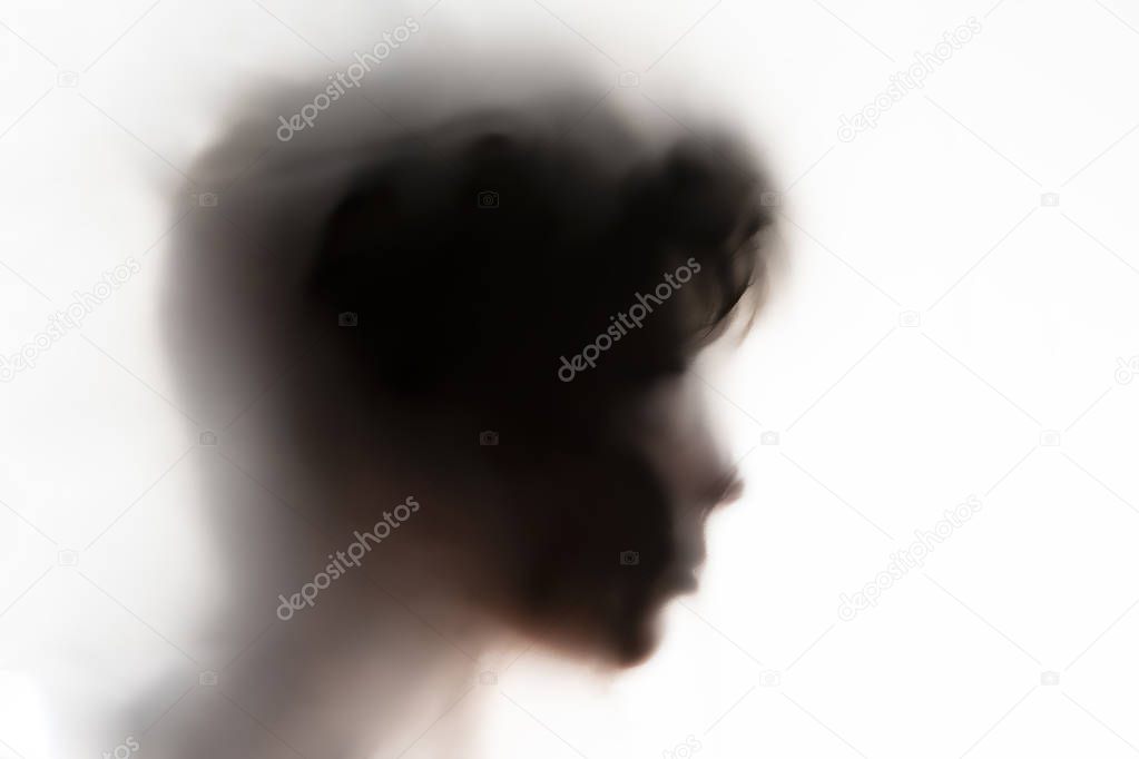 persons head shadow on a white glass or surface,terrible ghost in a night times