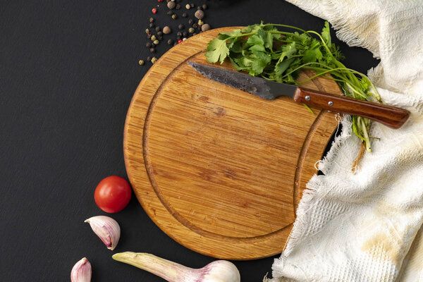 empty slicing or cut board on the table, herbs and spices laying around on the tables