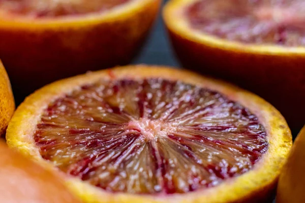 Macro shot of sliced red orange, dark food photo, exotic fruit — Stock Photo, Image