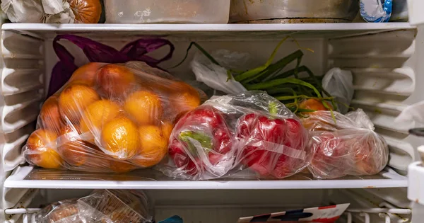 Plastic packages begs with fresh fruits veggies after the markets — Stock Photo, Image