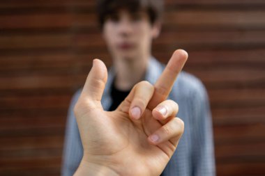 showing a middle finger to the person. disrespect sign clipart