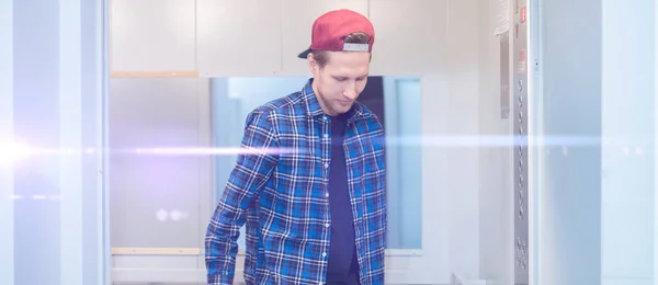 young man in casual come inside the lift elevator cabin