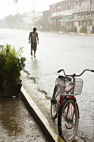 Boy Walking Street Red Bike Rain — Stock Photo, Image