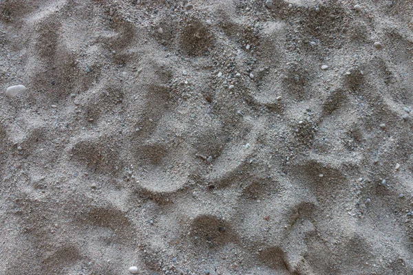 Imagem Areia Uma Praia Com Algumas Pequenas Pedras — Fotografia de Stock