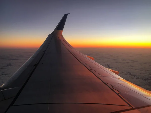 Wing of an airplane at sunset — Stock Photo, Image