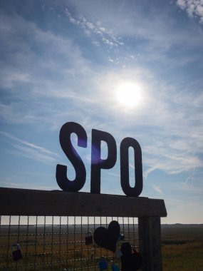 Love locks at the beach. SPO is short for St. Peter-Ording against blue sky clipart