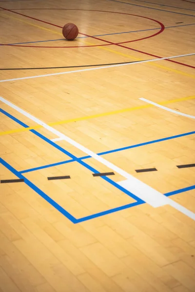 A basketball on a basket court