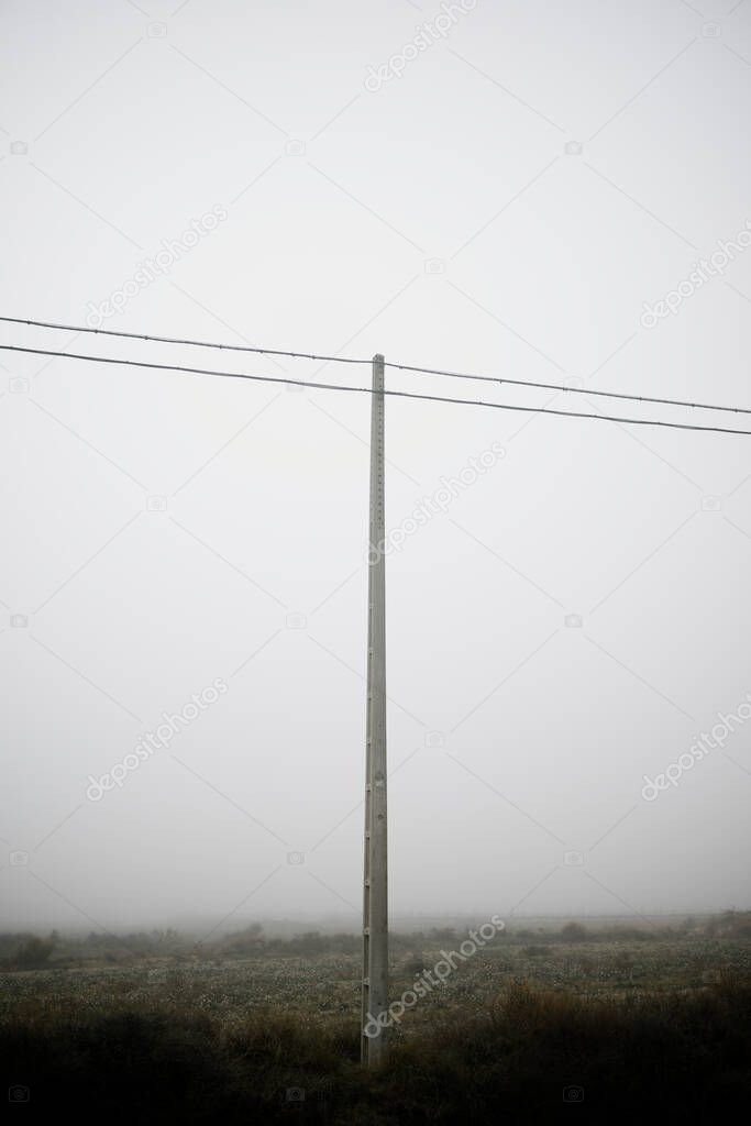 Power line between the fog, Zaragoza province in Spain.