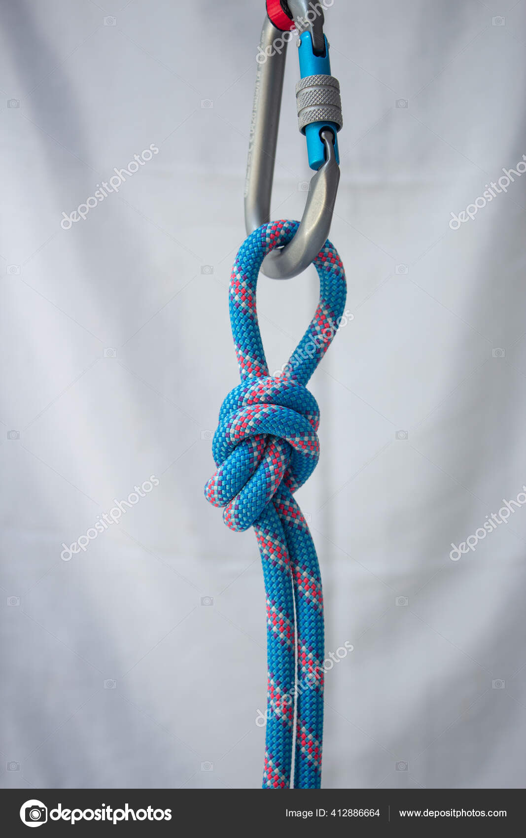 Overhand Knot Tied Climbing Rope Pear Shaped Locking Carabiner Stock Photo  by ©Cavan 412886664