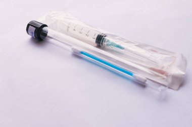 syringe and test swab  on a white background.