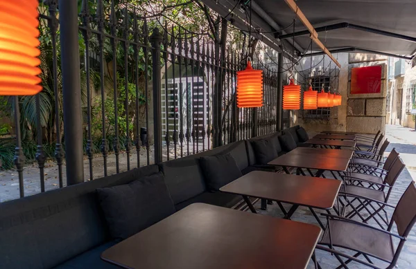 Tables Chairs Orange Lights Terrace Street — Stok fotoğraf
