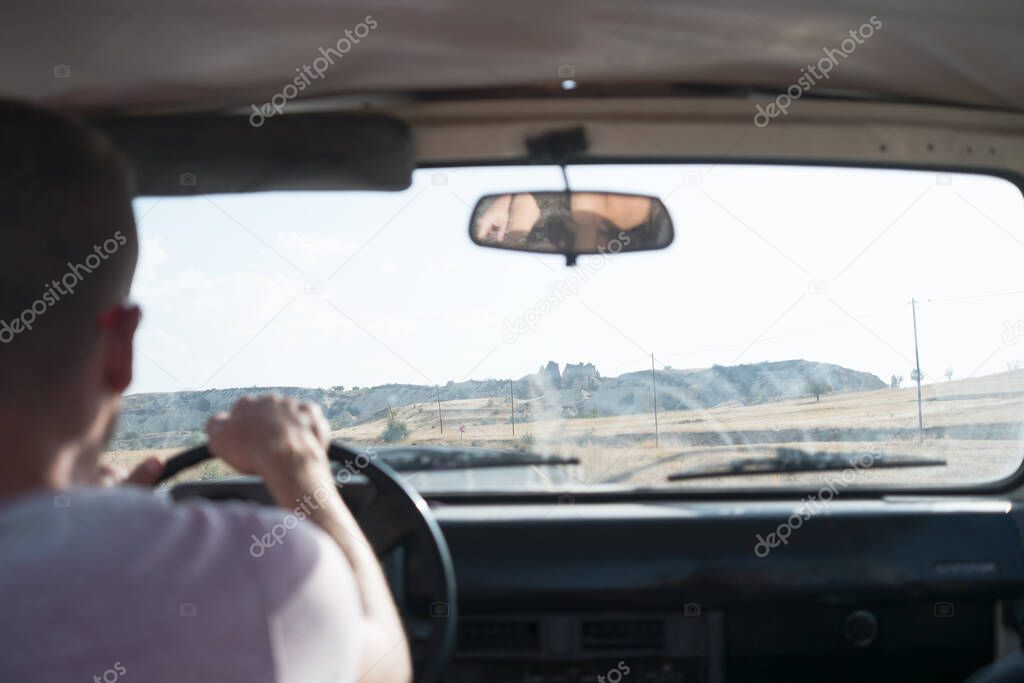 young man driving car, travel