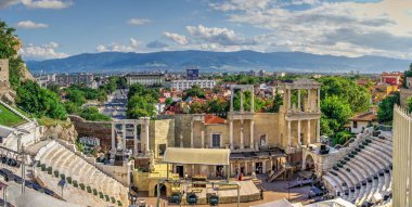 Plovdiv, Bulgaria - 07.24.2019. Ancient Roman amphitheater in Plovdiv, Bulgaria. Big size panoramic view on a sunny summer day clipart
