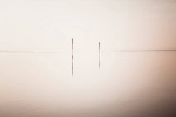 Water Surface Two Poles — 图库照片