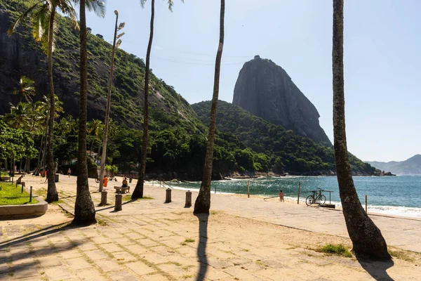 Beautiful view to Sugar Loaf Mountain from an empty beach on a sunny day, during covid-19 outbreak in Rio de Janeiro, Brazil