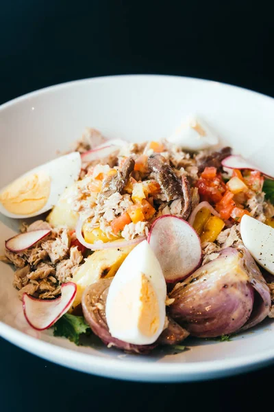 Tuna salad with egg in white bowl - Healthy food style
