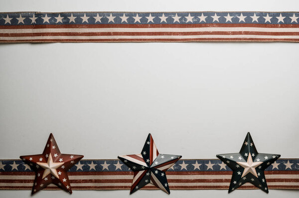 American stars and stripes flat lay over rustic wood background 