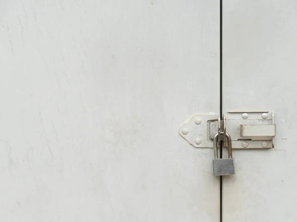 a mechanical device for securing a door or receptacle so that it cannot be opened except by a key or by a series of manipulations that can be carried out only by a person knowing the secret or code.