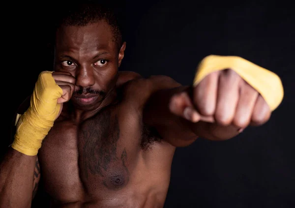 African Man Boxer Bandages Giving Direct Hit Black Background — Stock Photo, Image