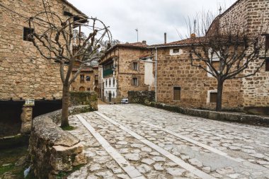 Streets of Orbaneja del Castillo in Burgos (Spain) without people clipart