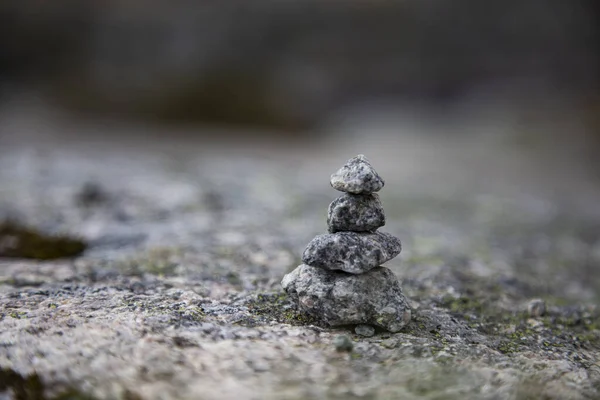 Tiny, cute rock marker, traditional norway markings, stone tower.