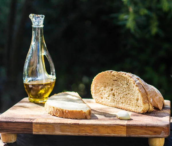 Food Concept Background Bread Pieces Bottle Oil Garlic — стоковое фото