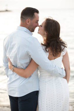 romantic loving couple posing at the ocean beach