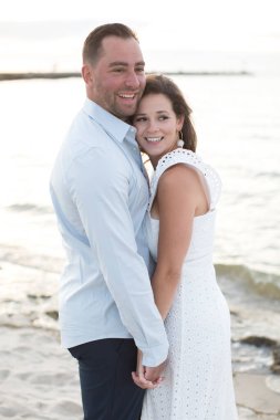 romantic loving couple posing at the ocean beach