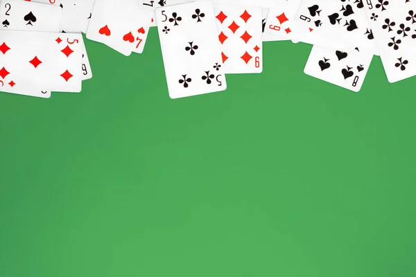 Deck of playing cards on blue background copy space