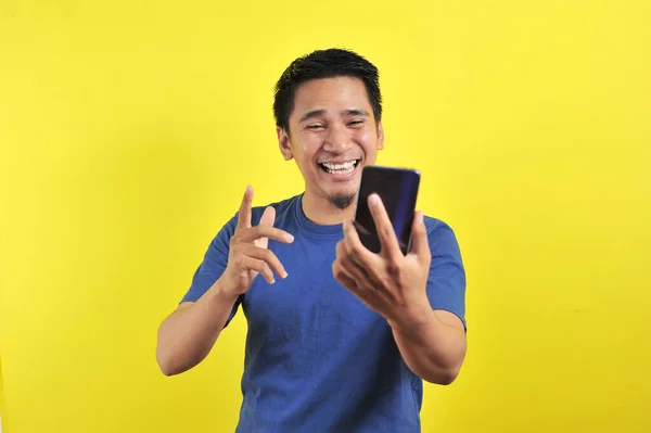 Happy Young Good Looking Asian Man Smiled Using Smartphone Isolated — Stok Foto