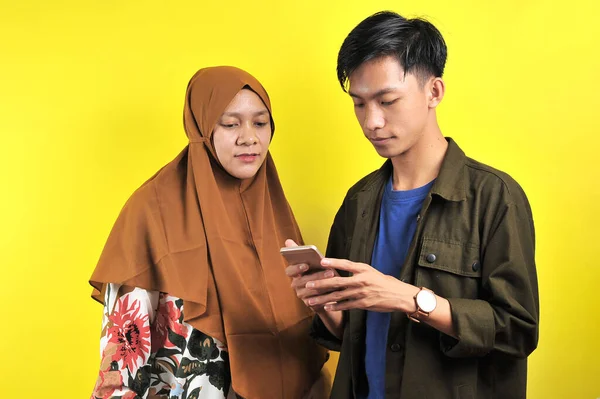 Portrait Two People Look Smartphone Display Isolated Yellow Background — Stok Foto