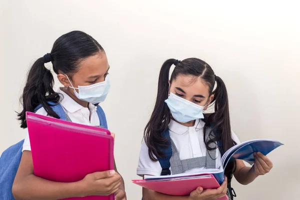 Schoolgirls Wearing Medical Mask Looking Notebook School Coronavirus Infection Little — Stock Photo, Image