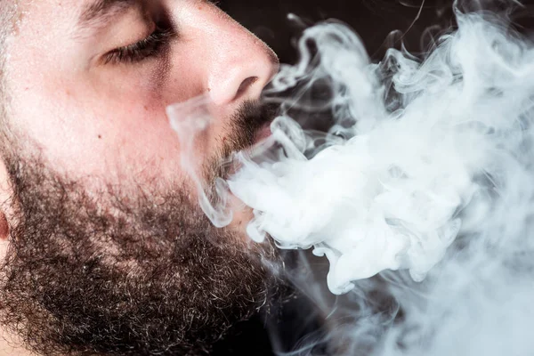 Detail Young Man Pigtail Exhales Smoke Nose Electronic Cigarette Black — Fotografia de Stock