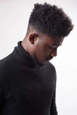 Serious authoritative bearded man looking down in front of the camera