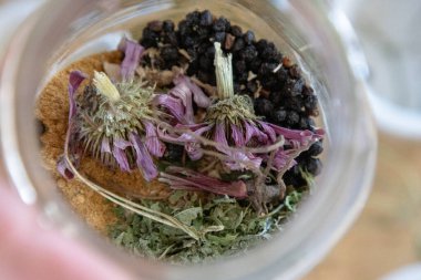 Close-up of echinacea and herbs in throat spray mix