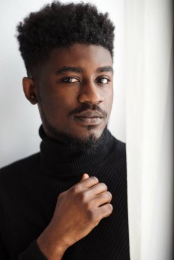 Partial image of sad young black man