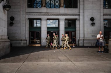 National Guard soldiers walk outside Union Station in Washington DC