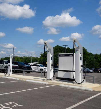 Pavement markings and EV charging station  at a car dealer ship.