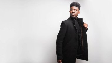 Handsome multiracial young man looking away while posing